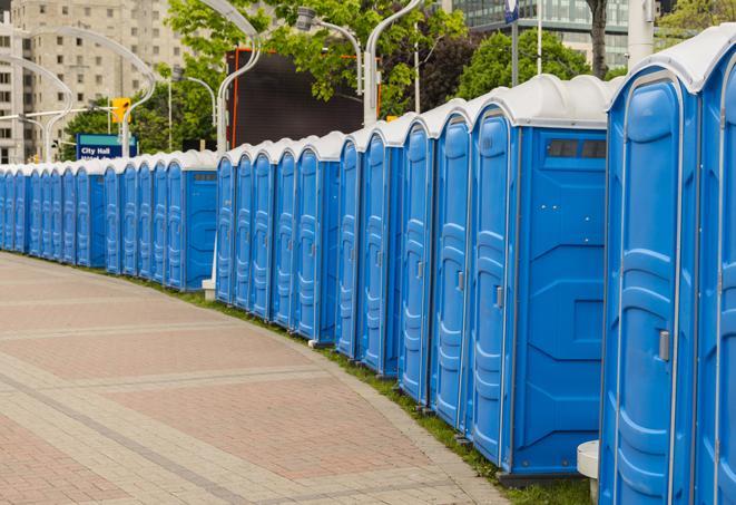 a row of sleek and modern portable restrooms at a special outdoor event in Auburn